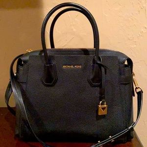 MK belted black satchel with shoulder strap.